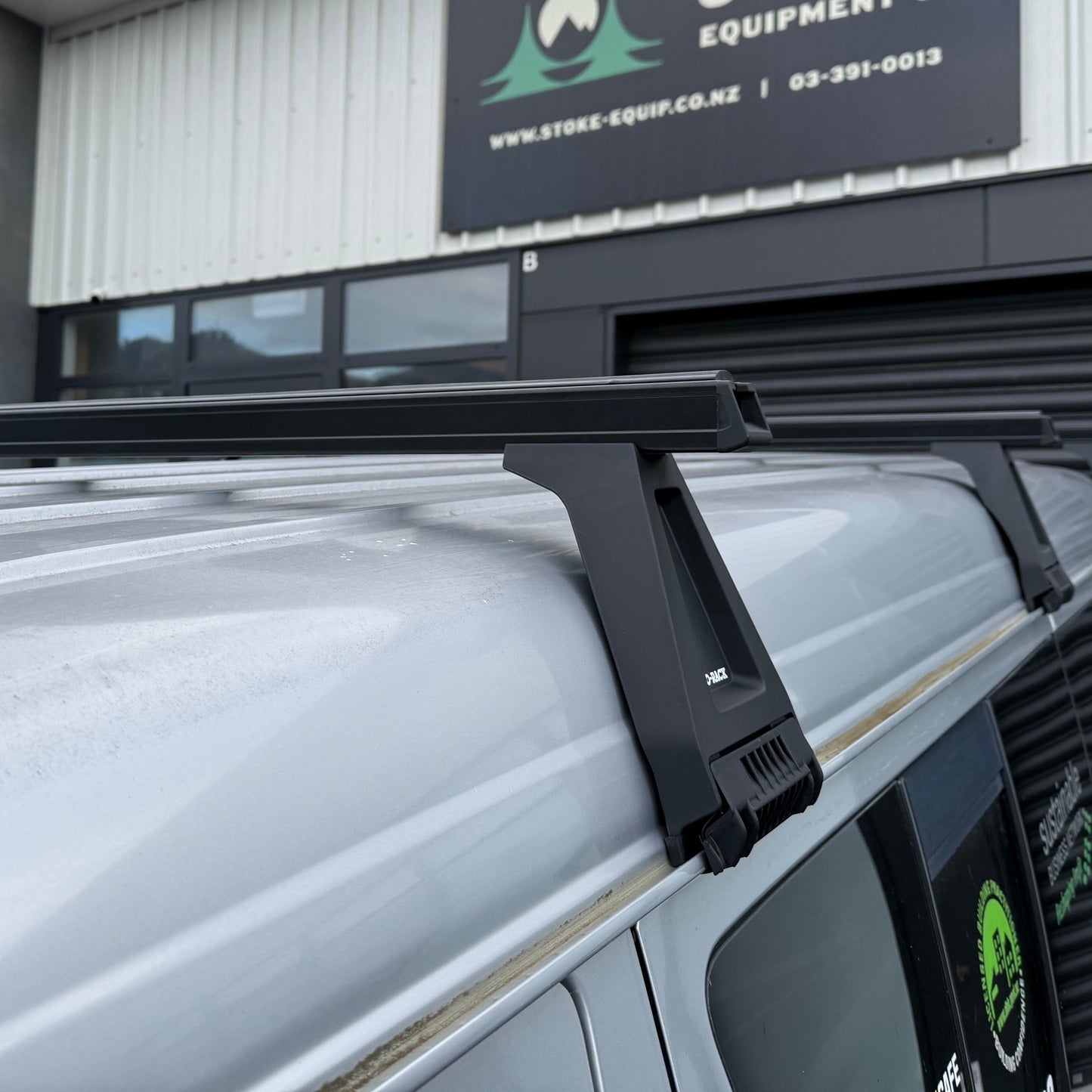 Roof rack on a vehicle in front of Stoke Equipment Co building