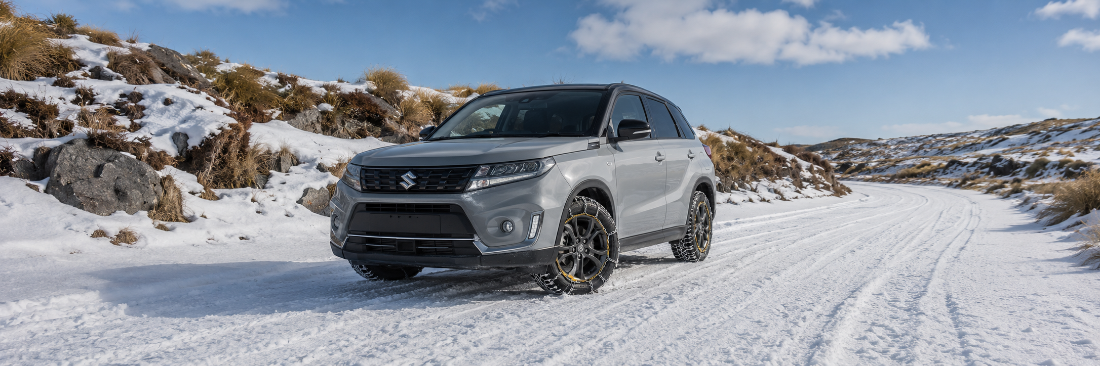 snowy,rocky, tussock alpine road with suzuki vitara with konig snow chains