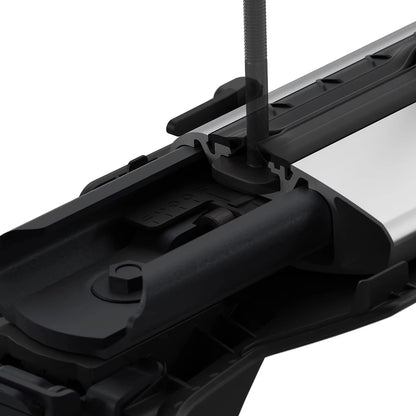 Close-up of a Thule 720400 Foot Pack demonstrating the channel accessory mount on top, with a white background
