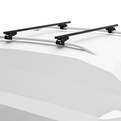 Black roof rack system on a white car