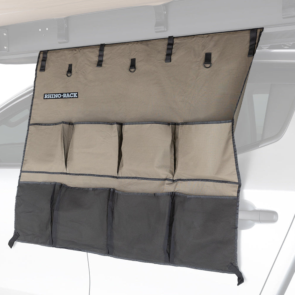 Car organizer hanging from a vehicle's rear window with 'Rhino-Rack' branding.