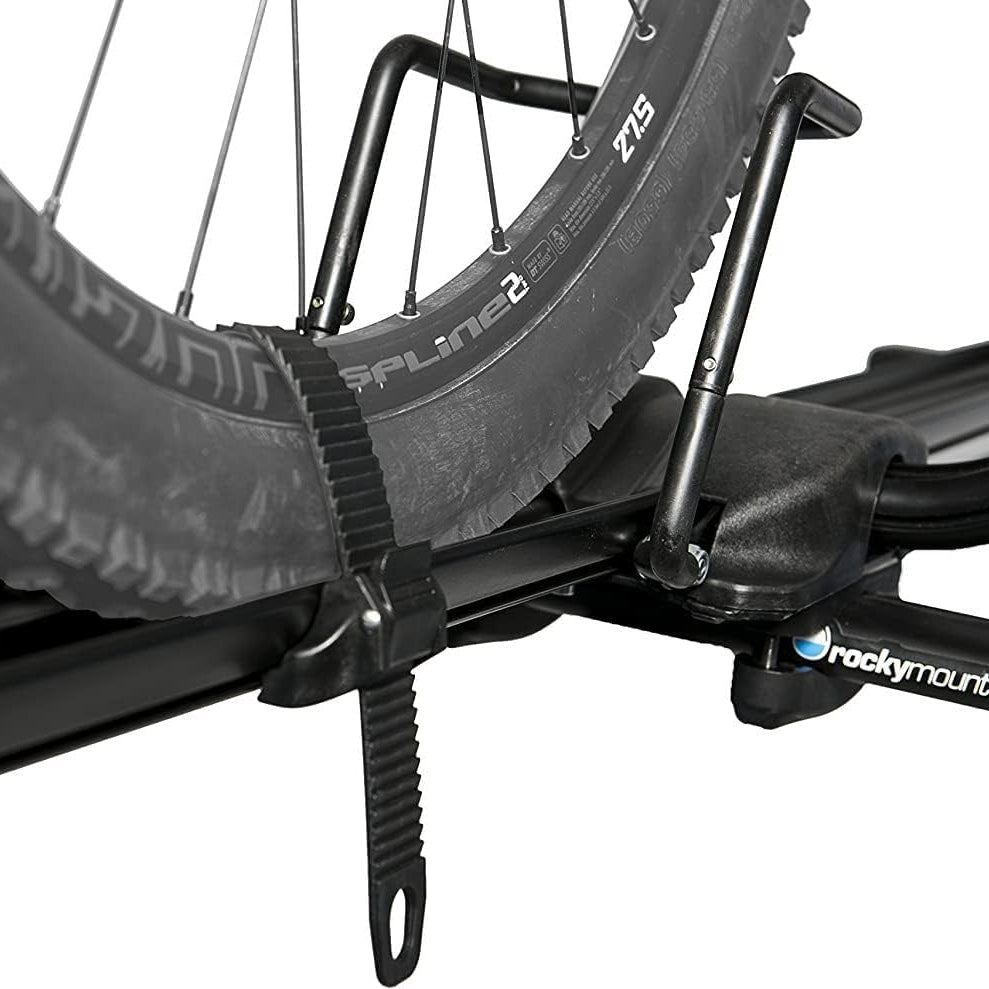 Close-up of a bike rack with a bicycle wheel, featuring the brand 'Rockymounts'.