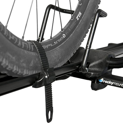 Close-up of a bike rack with a bicycle wheel, featuring the brand 'Rockymounts'.