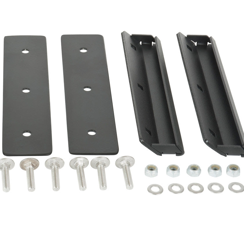 Set of metal brackets and screws on a white background