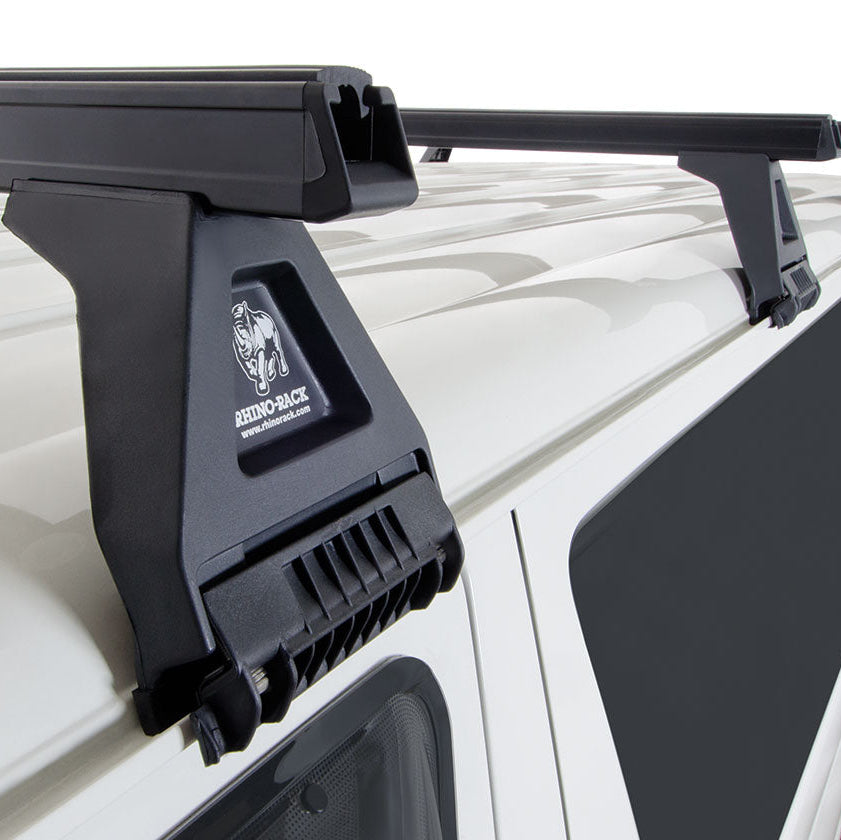Roof rack system on a vehicle with visible brand logo.