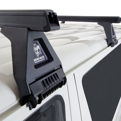 Roof rack system on a vehicle with visible brand logo.