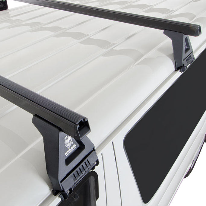 Roof rack system on a white vehicle with a clear background