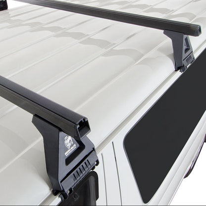 Roof rack system on a white vehicle with a clear background