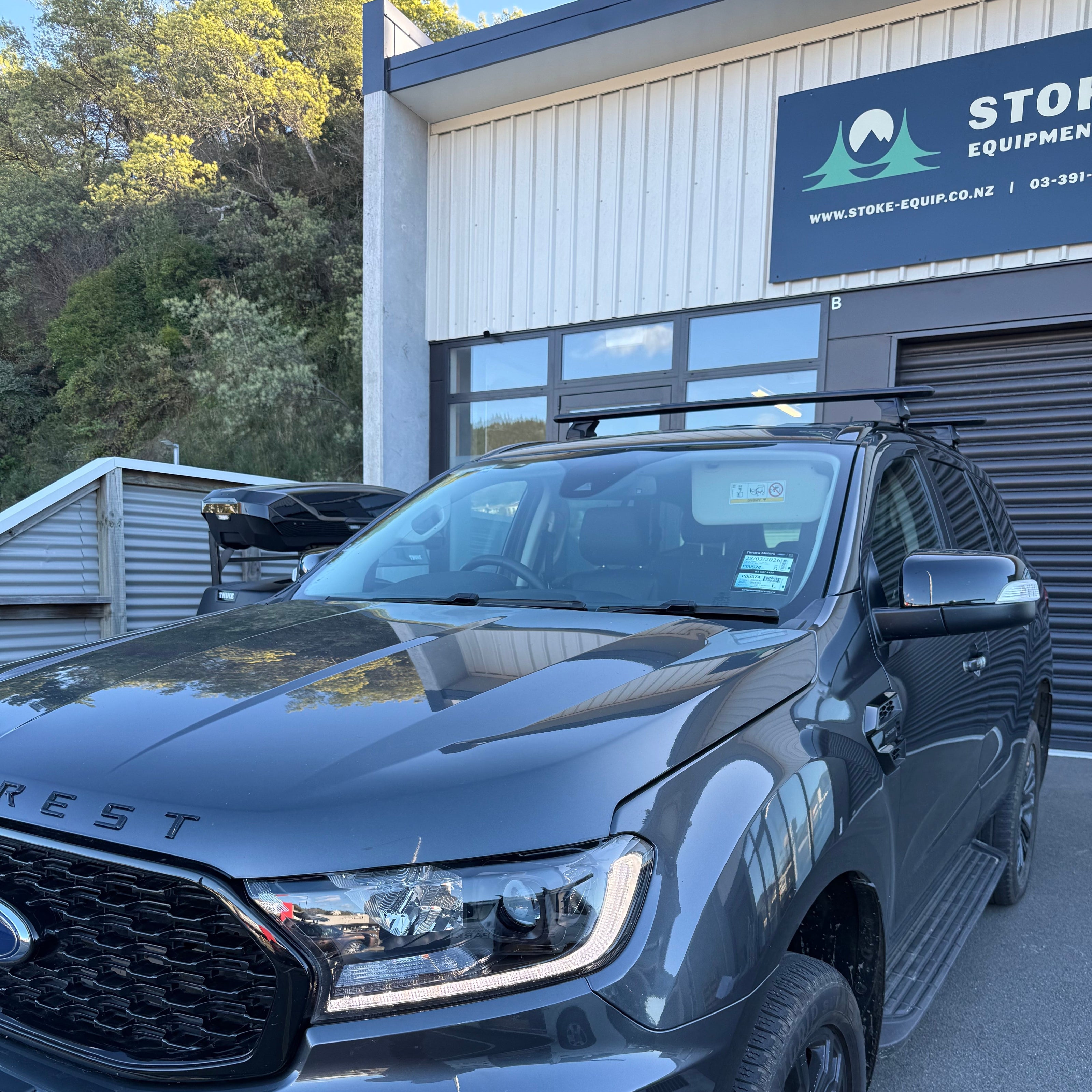 Ford Everest fitted with thule wingbar evo roof racks, parked outside stoke equipment co