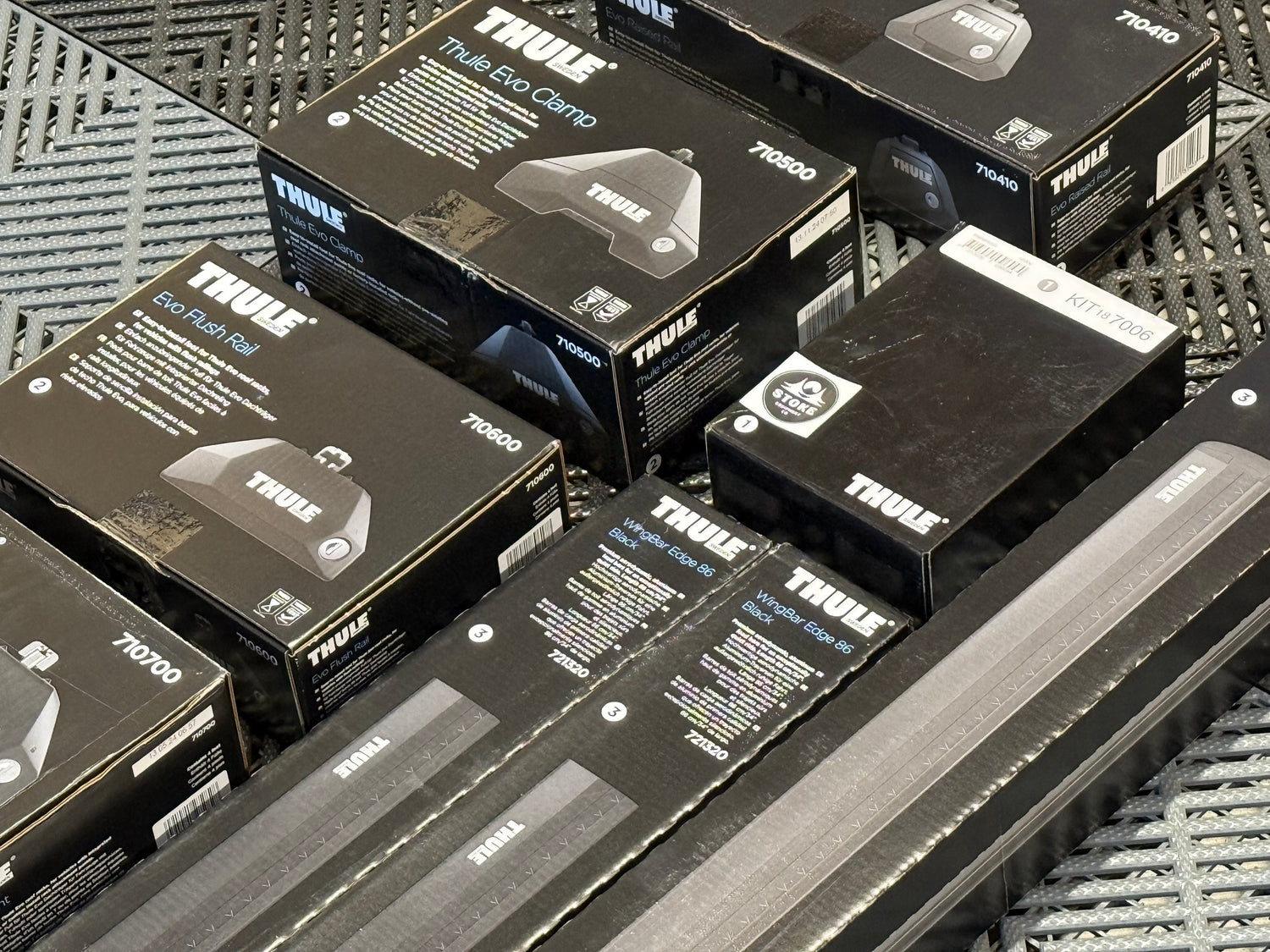 Collection of Thule packaging on a textured surface