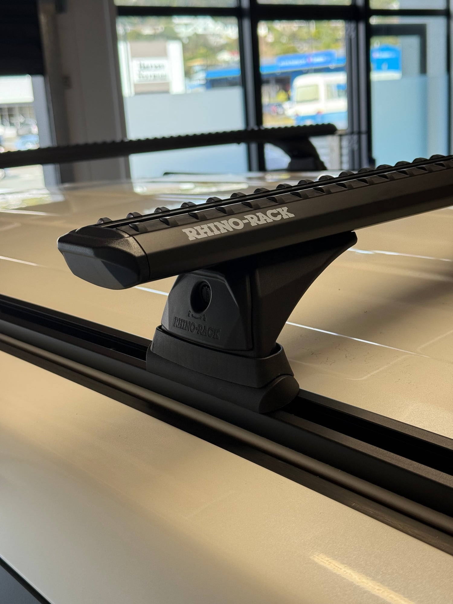 Close-up of a Rhino-Rack Track Mount Roof Rack system, professionally installed at Stoke Equipment Co Nelson