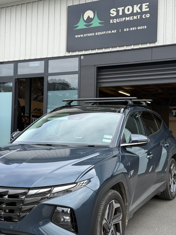 Hyundai Tucson with rhino-rack sportz roof racks, parked outside stoke equipment co