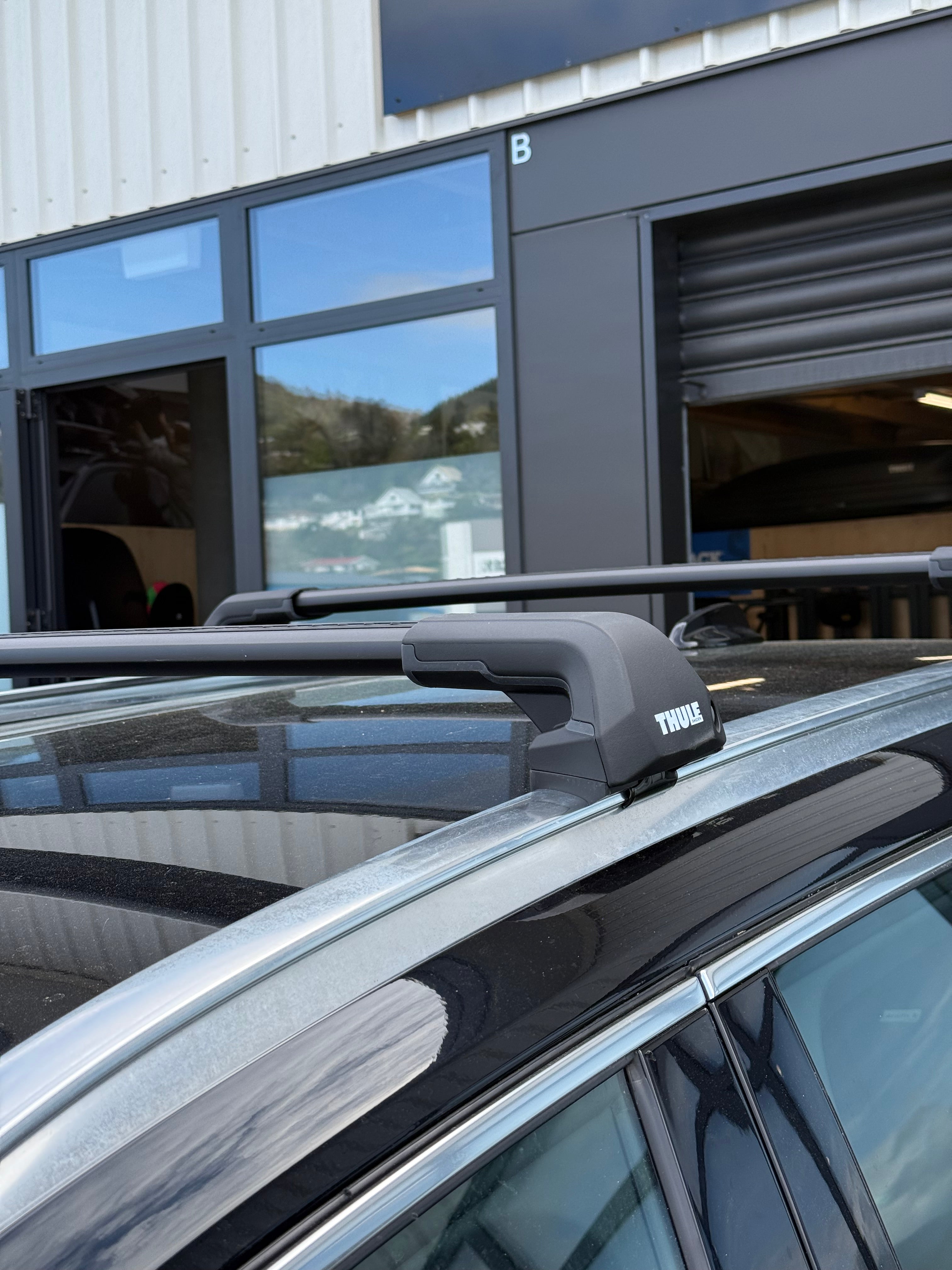 Thule 720600 Flush Rail Roof Rack system fitted to a vehicle parked outside Stoke Equipment Co - Thule Roof Rack Specialist Store in Nelson New Zealand