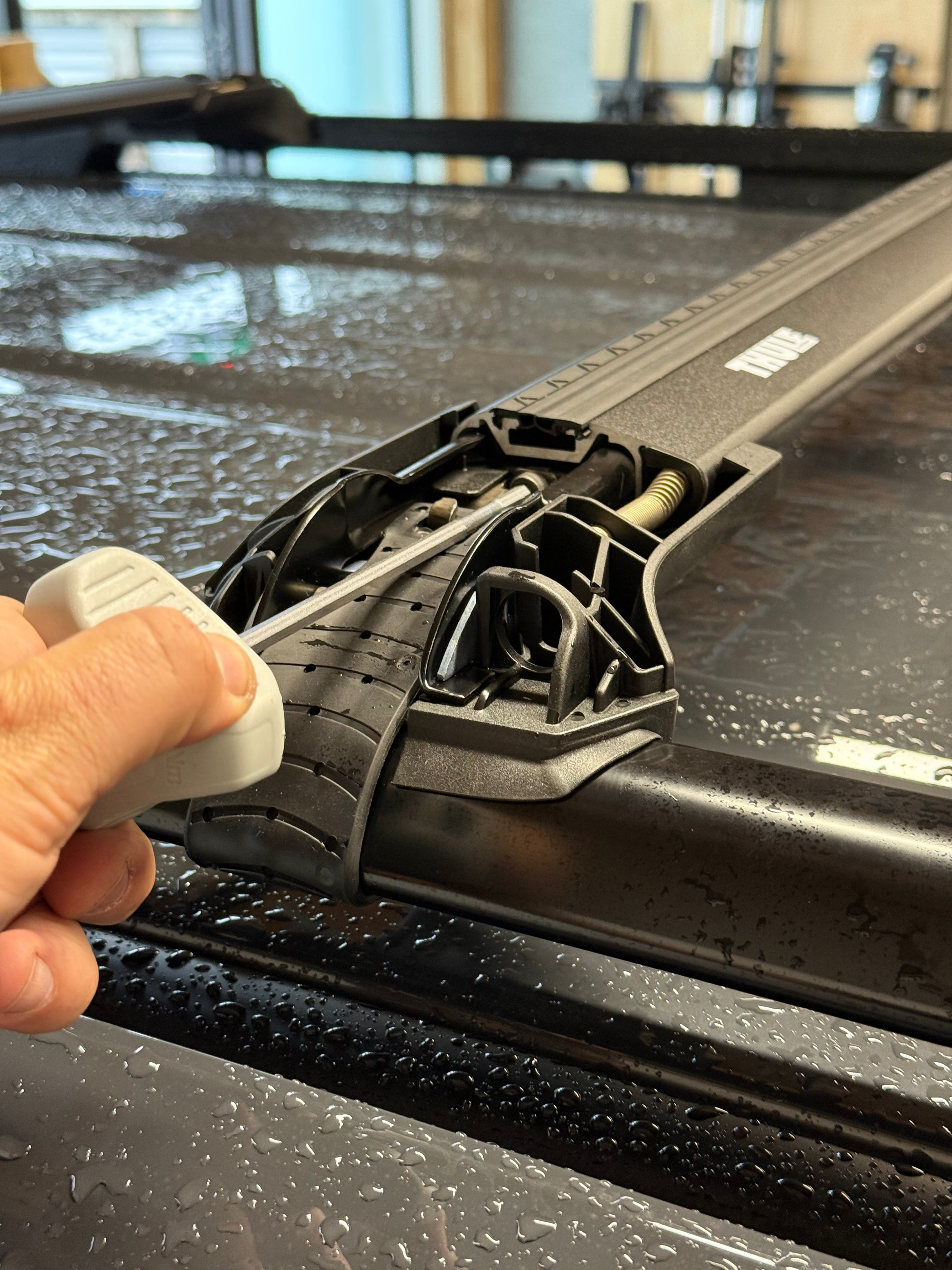 thule 720400 raised rail footpack showing installation process with torque limiting tool