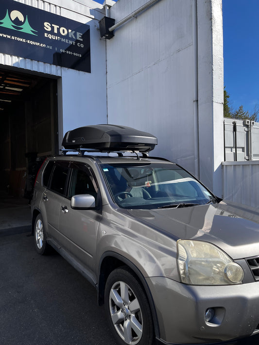 nissan x trail with thule wingbar roof racks and thule roof box 34