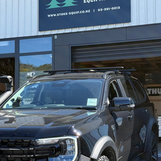 Thule WingBar Evo Black Roof Rack Kit on a Ford Everest parked outside Stoke Equipment Co