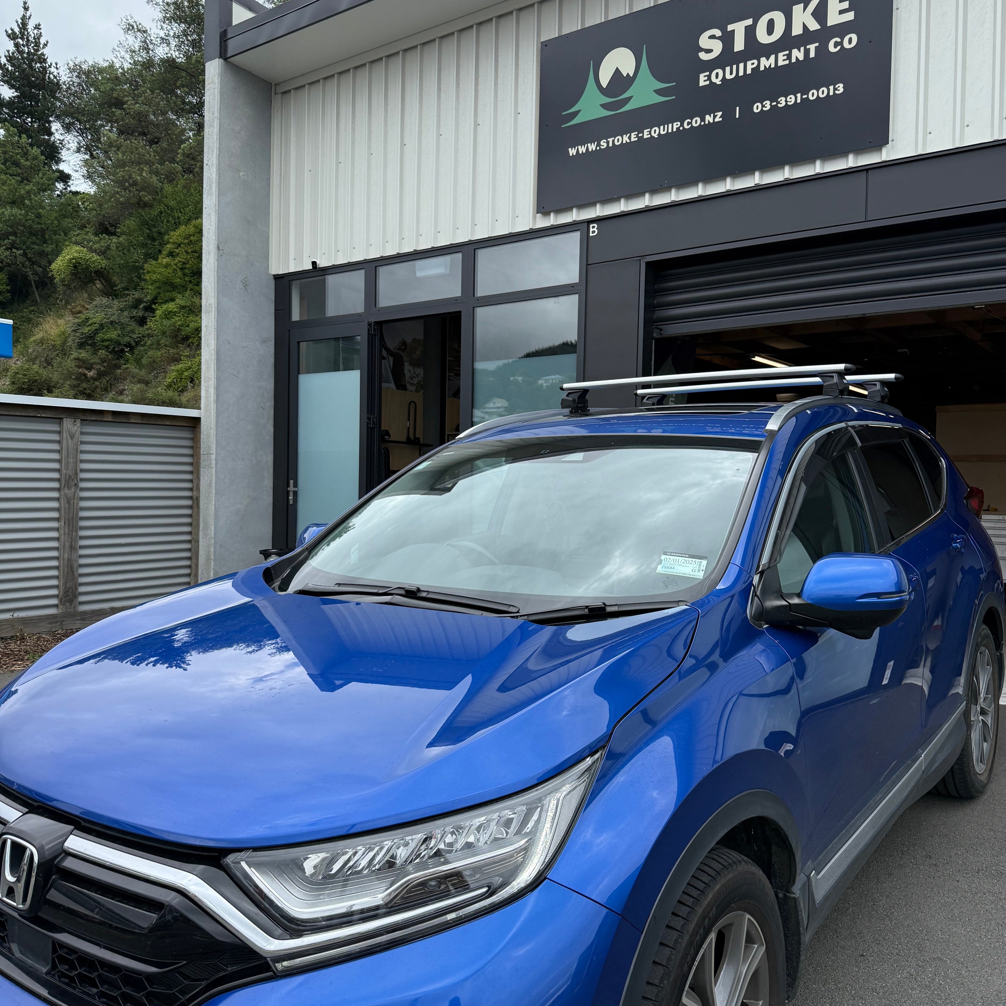 Honda CRV or CR-V fitted with a silver Thule wingbar evo roof rack system parked outside Nelson official Thule dealer Stoke Equipment Co