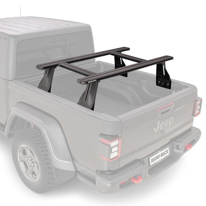 A black metal roof rack mounted on the bed of a light gray Jeep Gladiator pickup truck, shown against a plain white background.