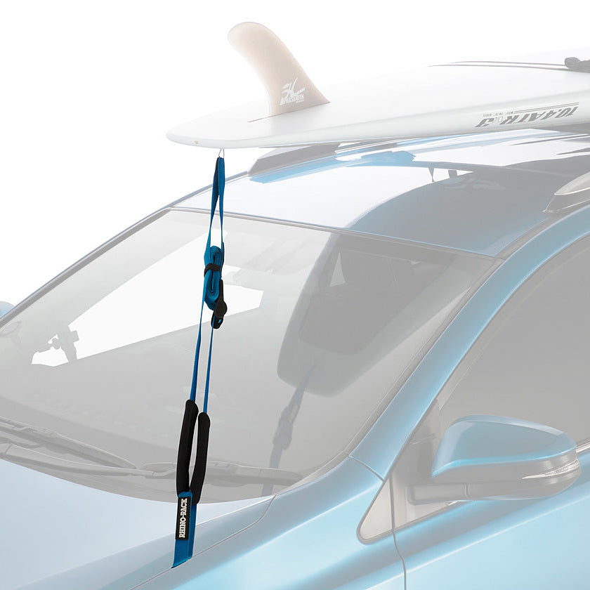 Car with a paddleboard on the roof and a blue strap.