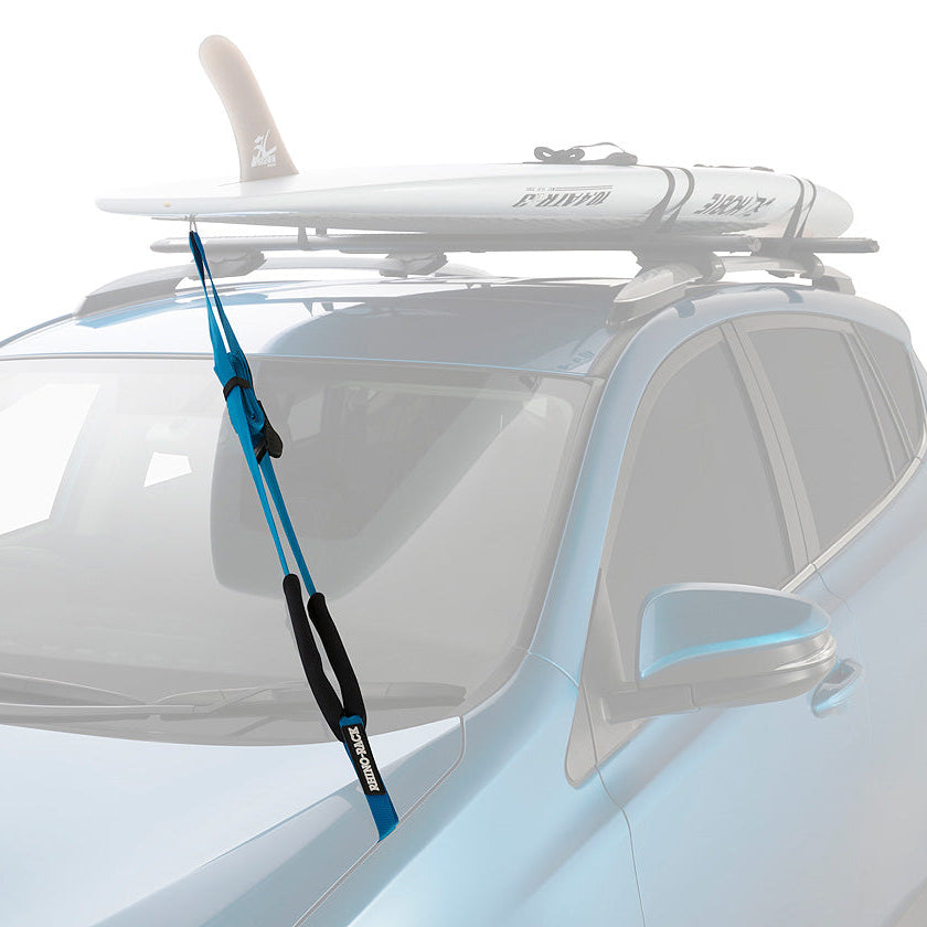 Car with a surfboard mounted on a roof rack against a white background