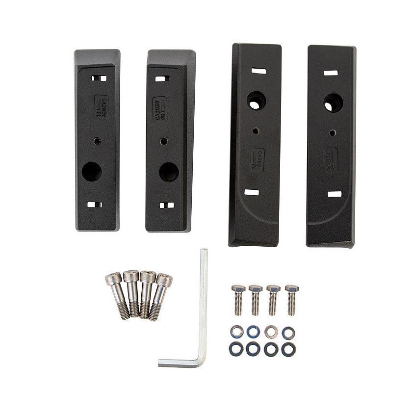 Set of black metal brackets and screws on a white background