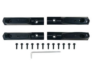 Set of black metal brackets with screws and a wrench on a white background