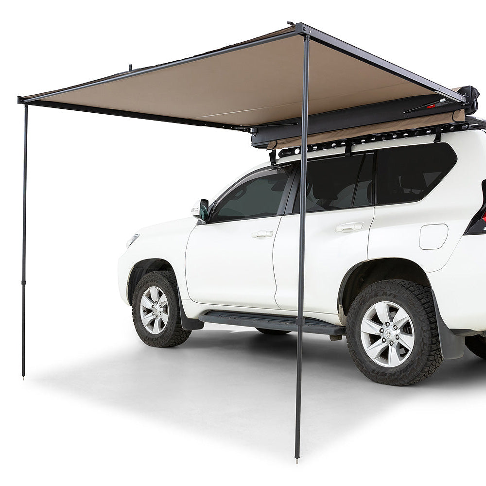 White SUV with a beige retractable roof awning on a white background
