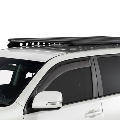 White SUV with a black roof rack on a white background