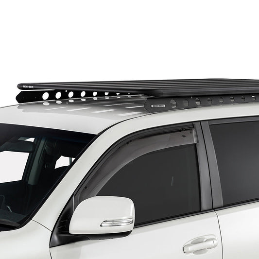 White SUV with a black roof rack on a white background