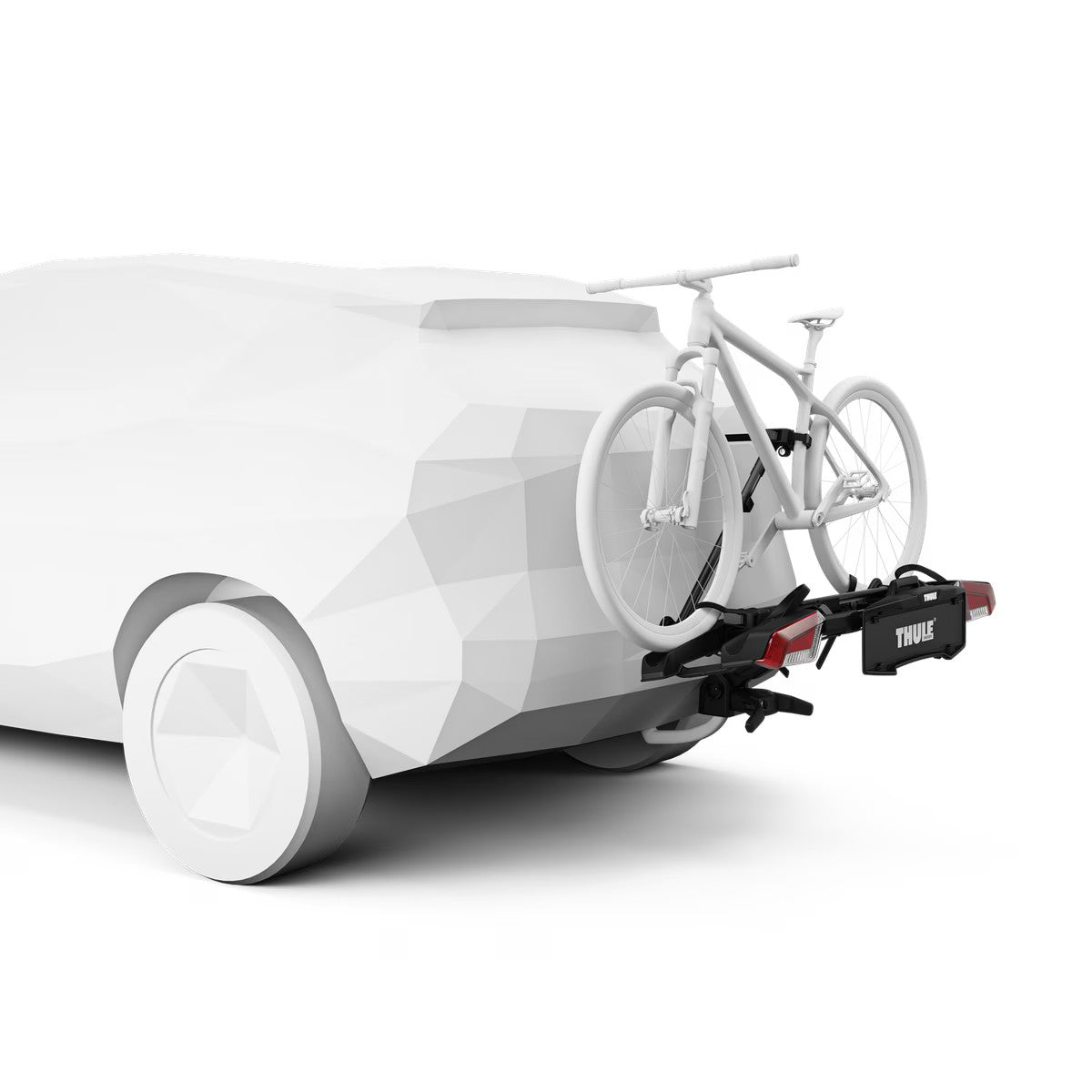 White electric vehicle with a bicycle attached to a carrier on a white background