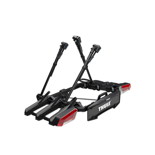 Black bike rack with red reflectors on a white background, featuring the Thule brand.