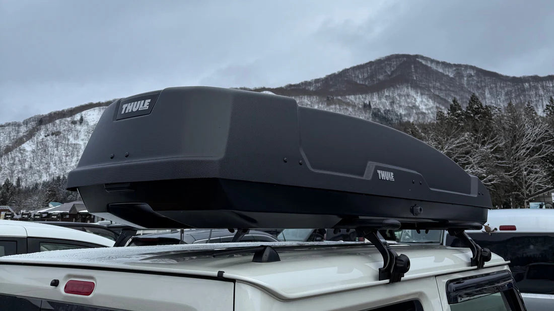 Thule Force XT Roof Box in a ski field carpark